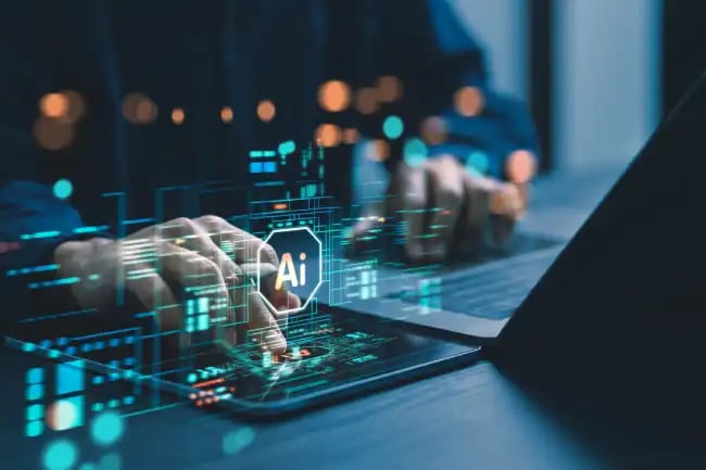 Hands using laptop and tablet with AI interface visuals, representing advanced computing powering Sweden’s Mimer AI factory