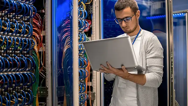 Technician working on cables