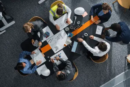 aerial view of a group working around a table