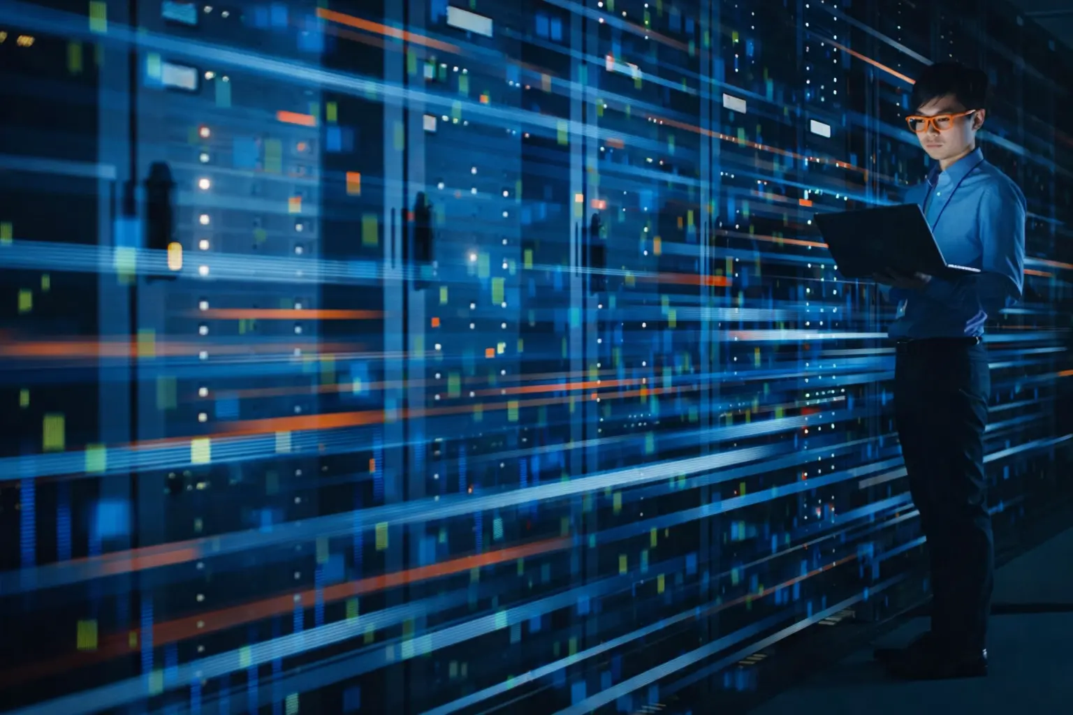 Technician monitoring a digital server interface with glowing blue data streams, representing secure sovereign virtualization