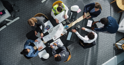 Aerial view of people around a meeting room table
