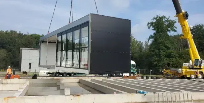 Modular JUPITER data centre being lifted into place by a crane